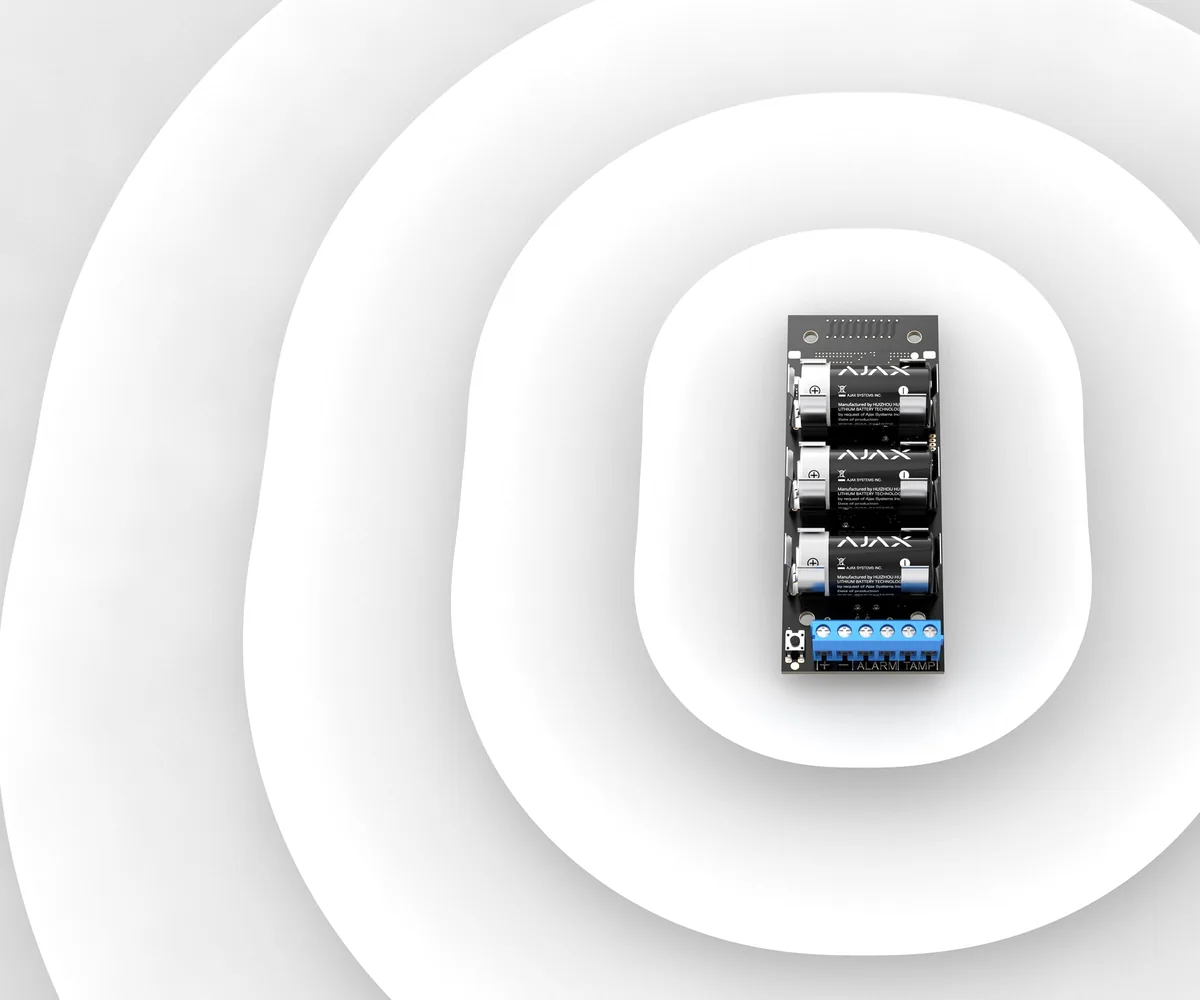 Ajax Transmitter module showing the screw terminal block where an existing wired alarm detector connects to the wireless system