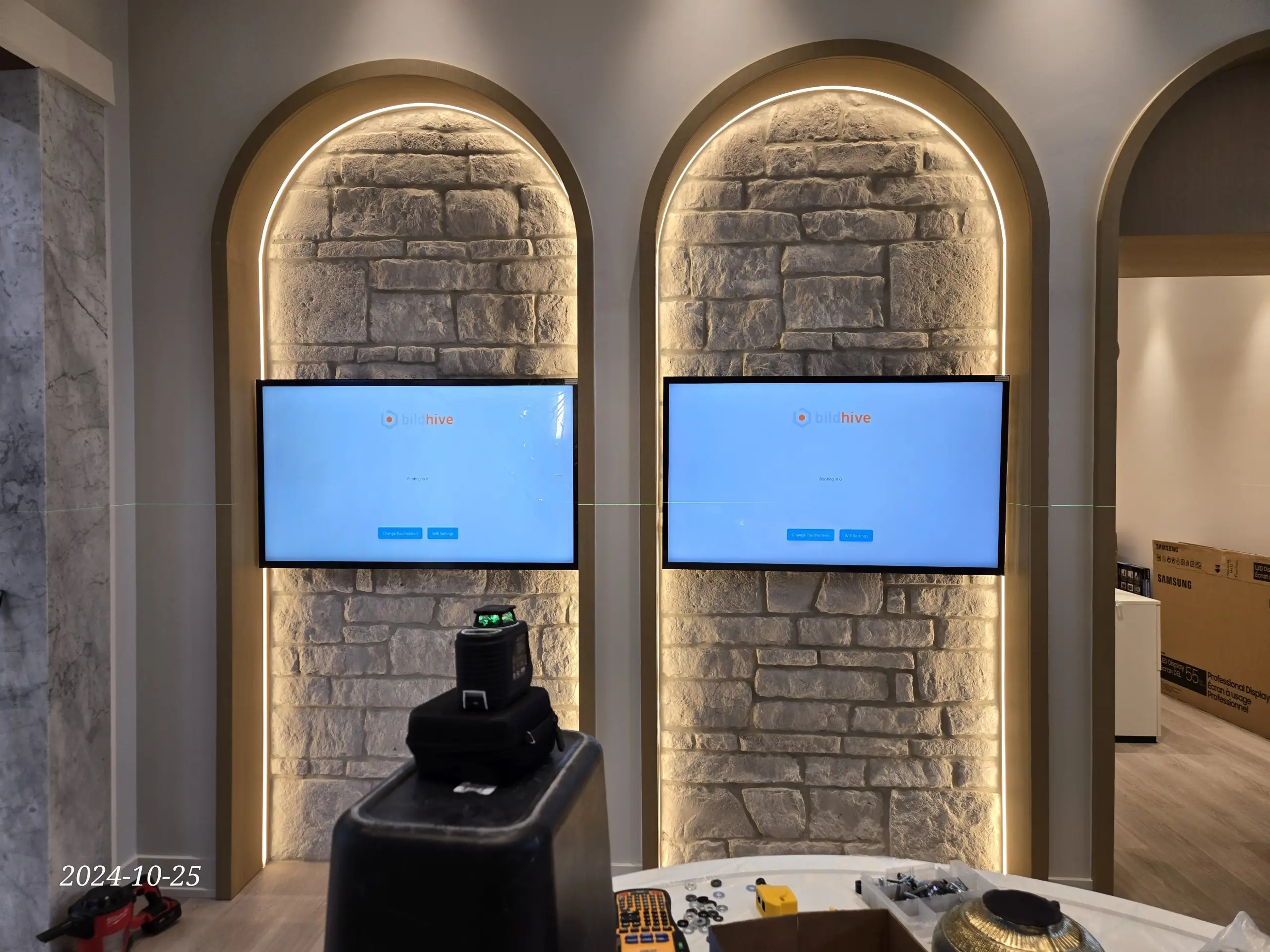 Dual TV with stone arch, full AV integration, Oakville home