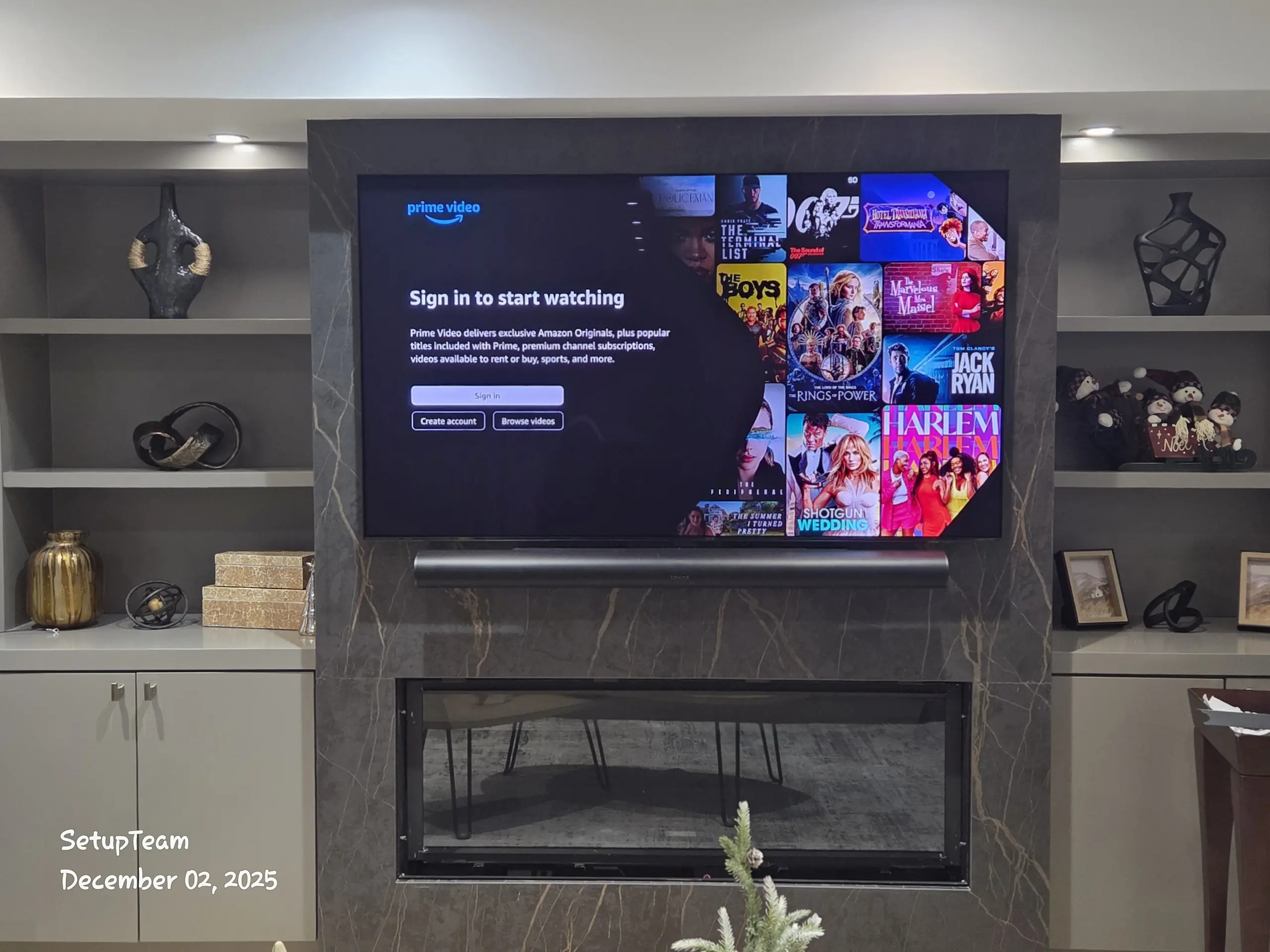 TV above tiled fireplace, Sonos Arc, built-in shelving