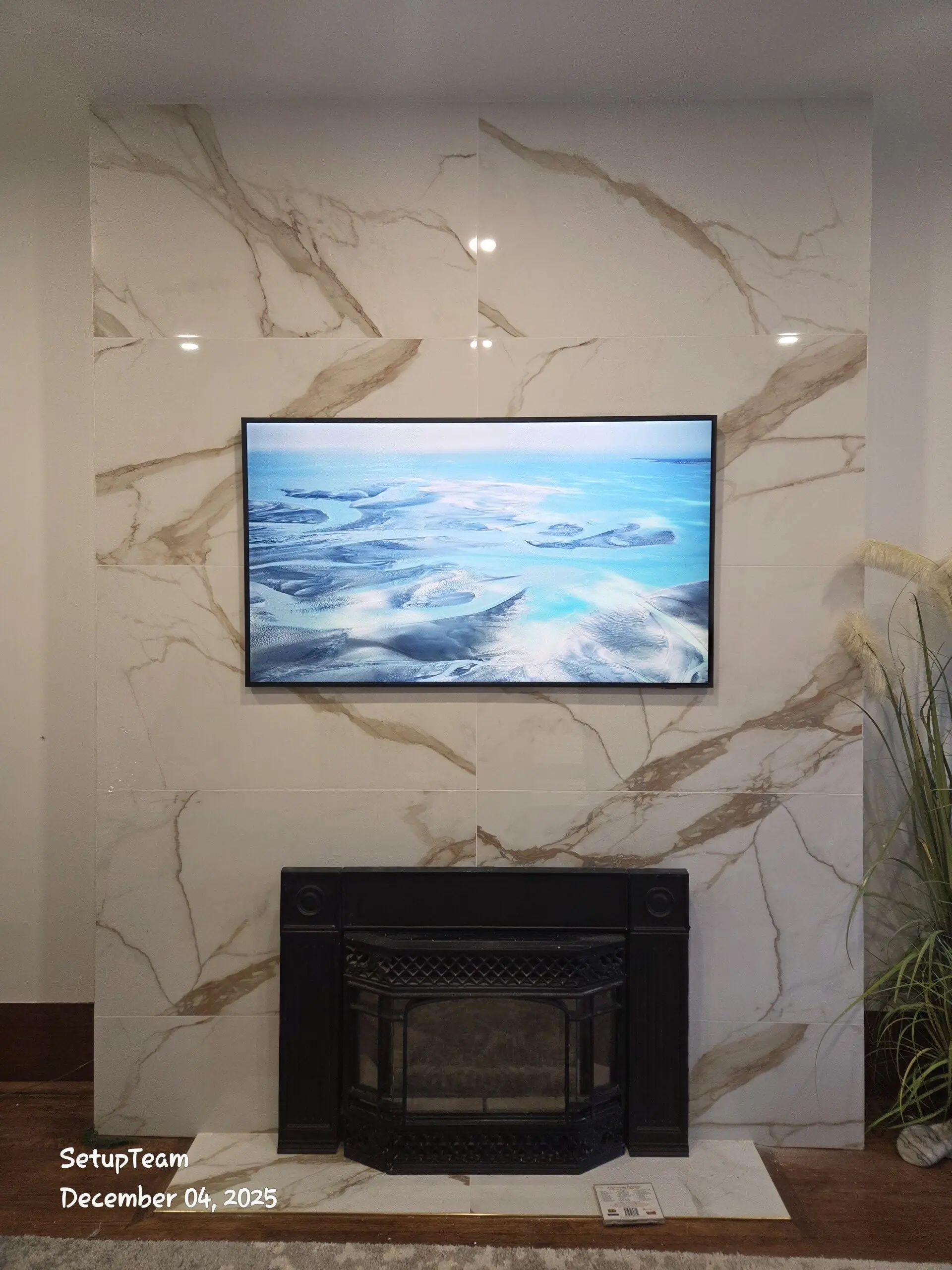 Samsung Frame TV mounted on porcelain tile feature wall with concealed wiring — GTA installation by SetupTeam