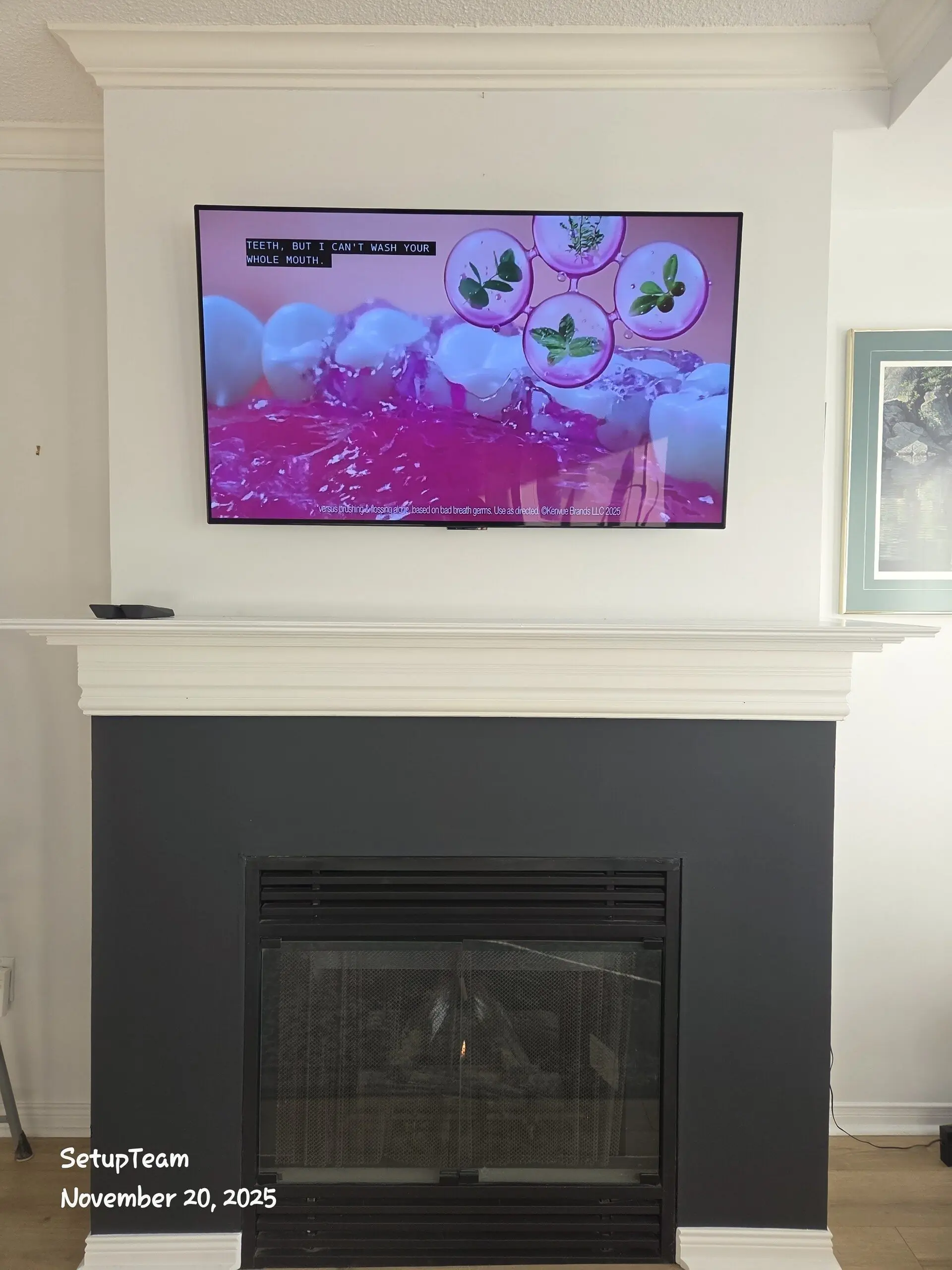 TV wall mounted above a fireplace with cables concealed behind the wall in a Gormley home north of Toronto