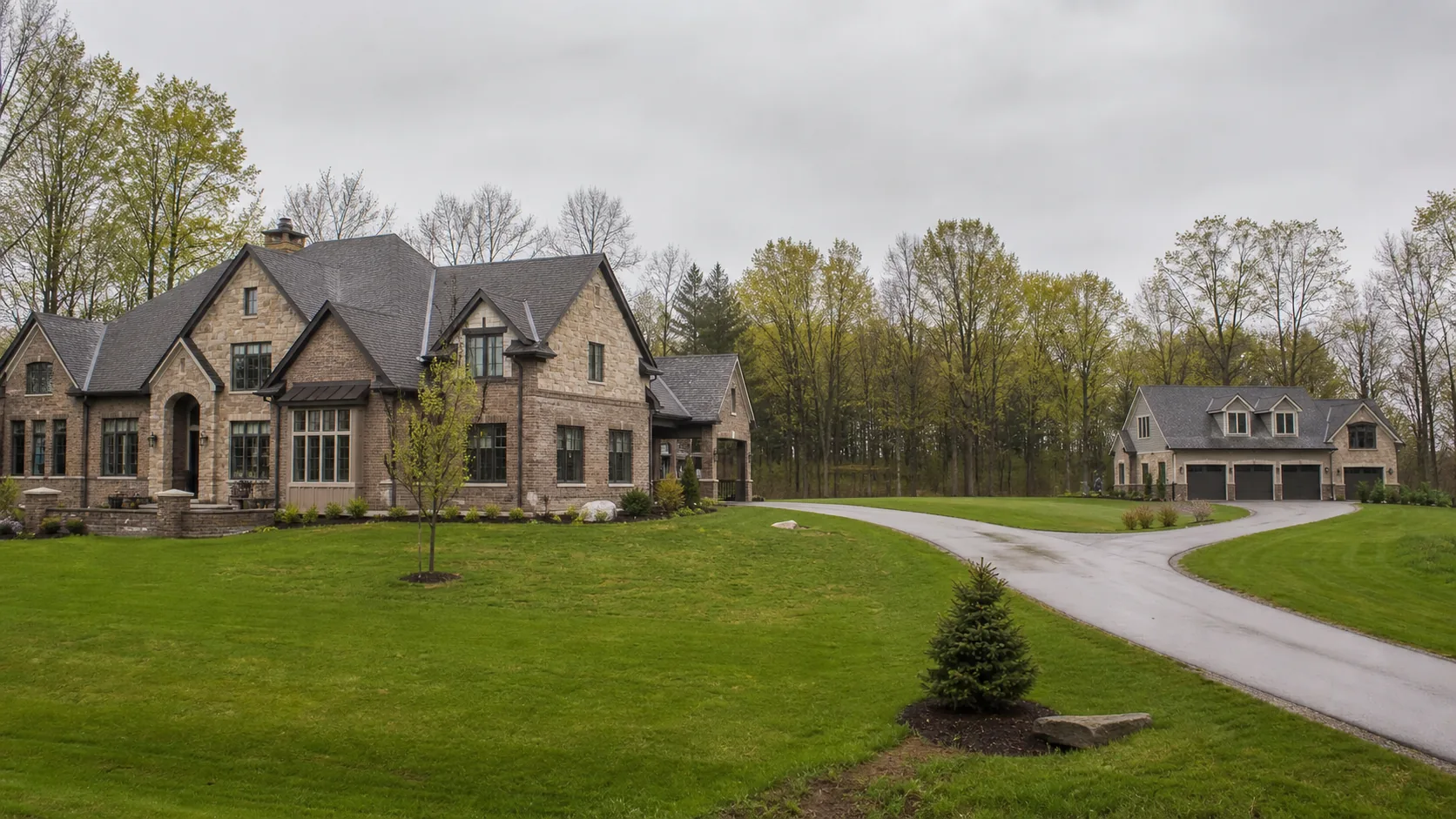 Large King Township estate with a main residence and detached coach house separated across the property