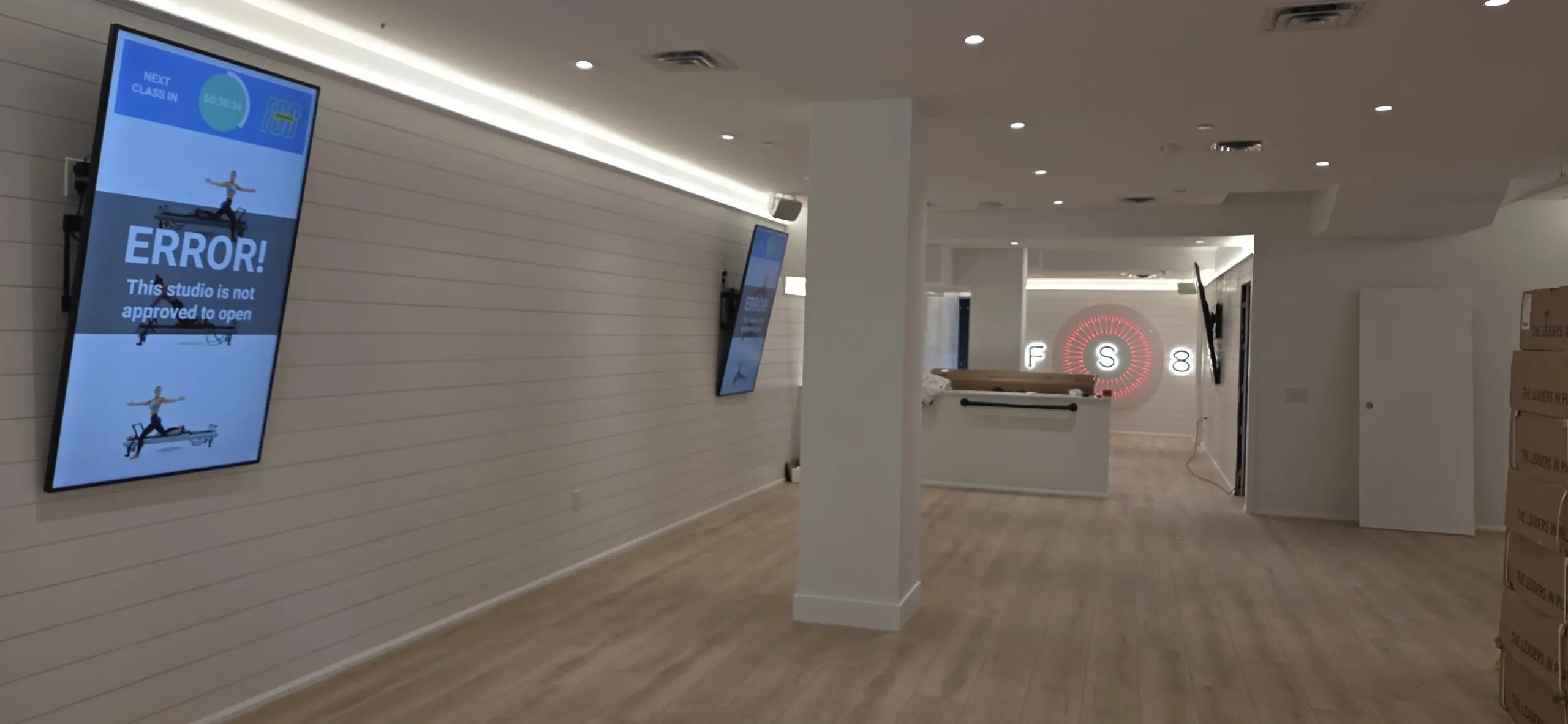Commercial TV digital signage installation at a fitness studio