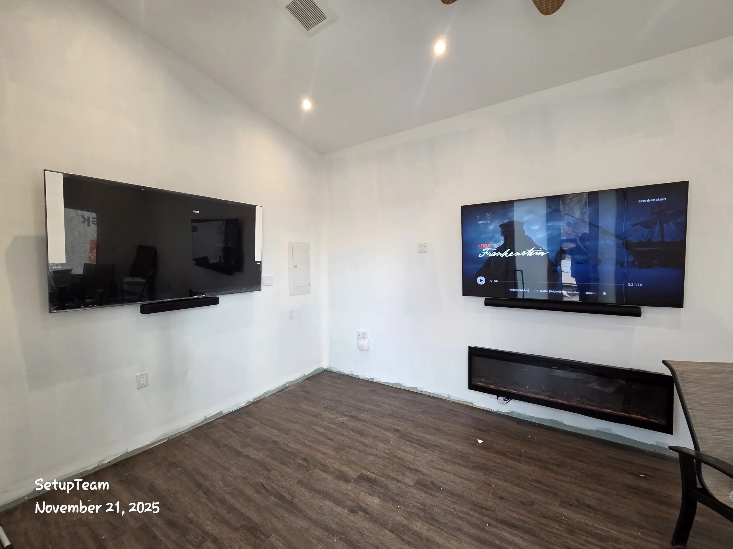 Mississauga man cave with dual TV wall mount and electric fireplace
