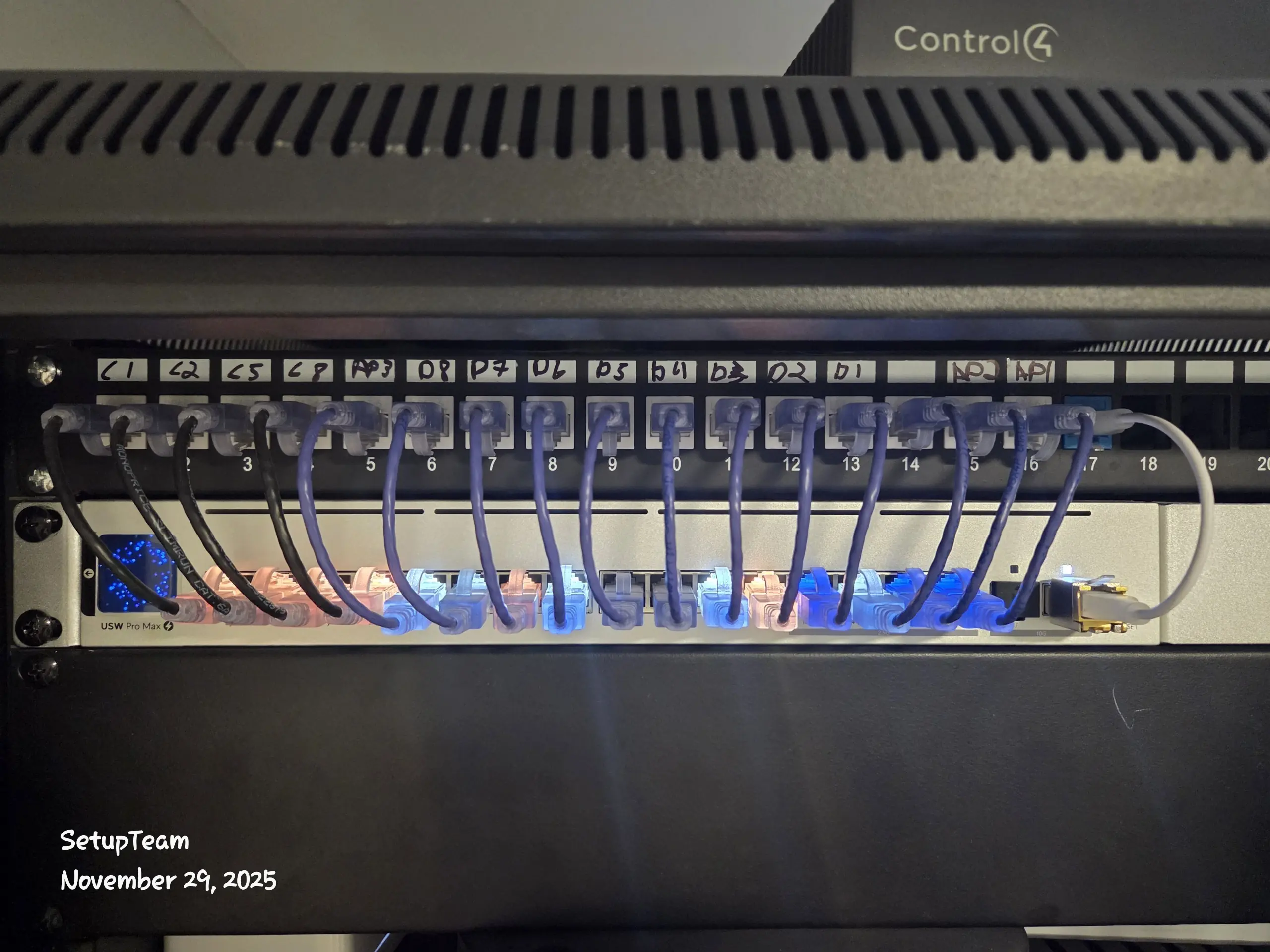 Network rack with patch panel, labeled cables, and neat cable management