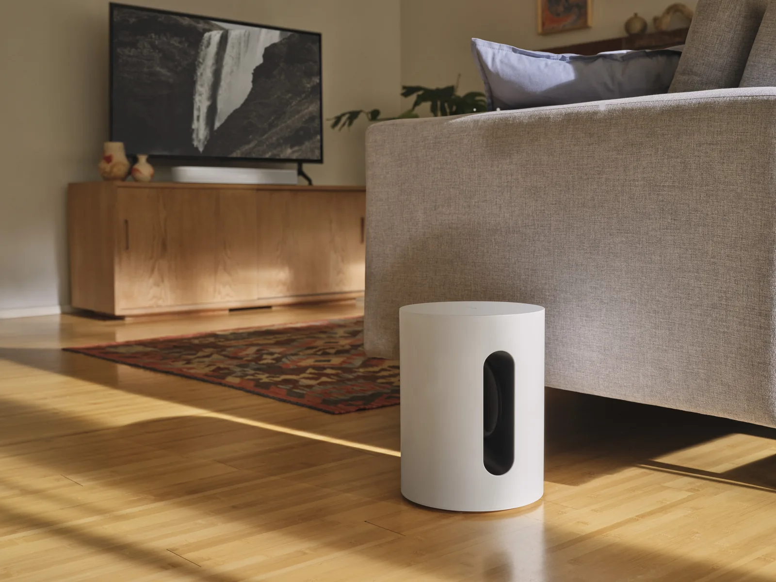 Sonos Sub Mini subwoofer in white in a living room