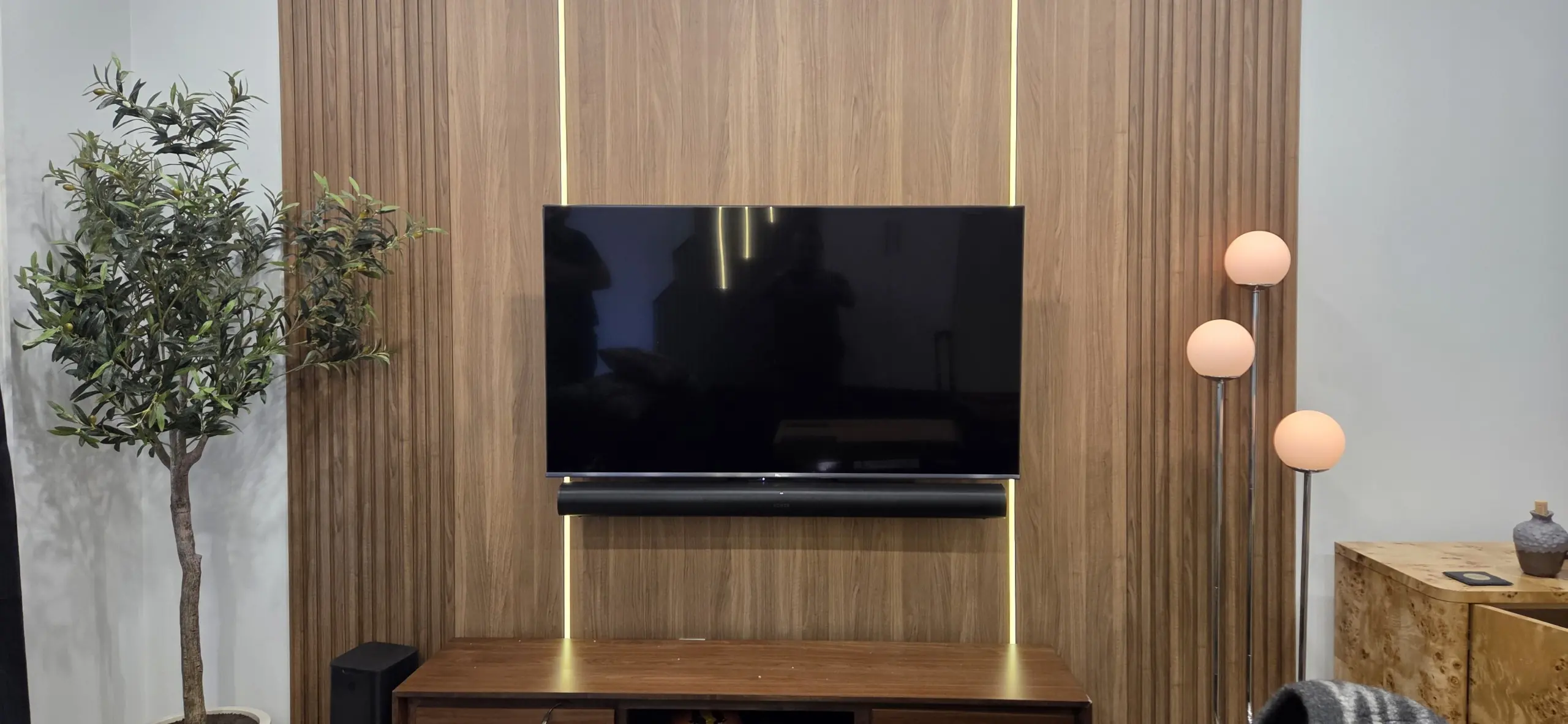 LG TV with Sonos Arc soundbar below, no cables visible