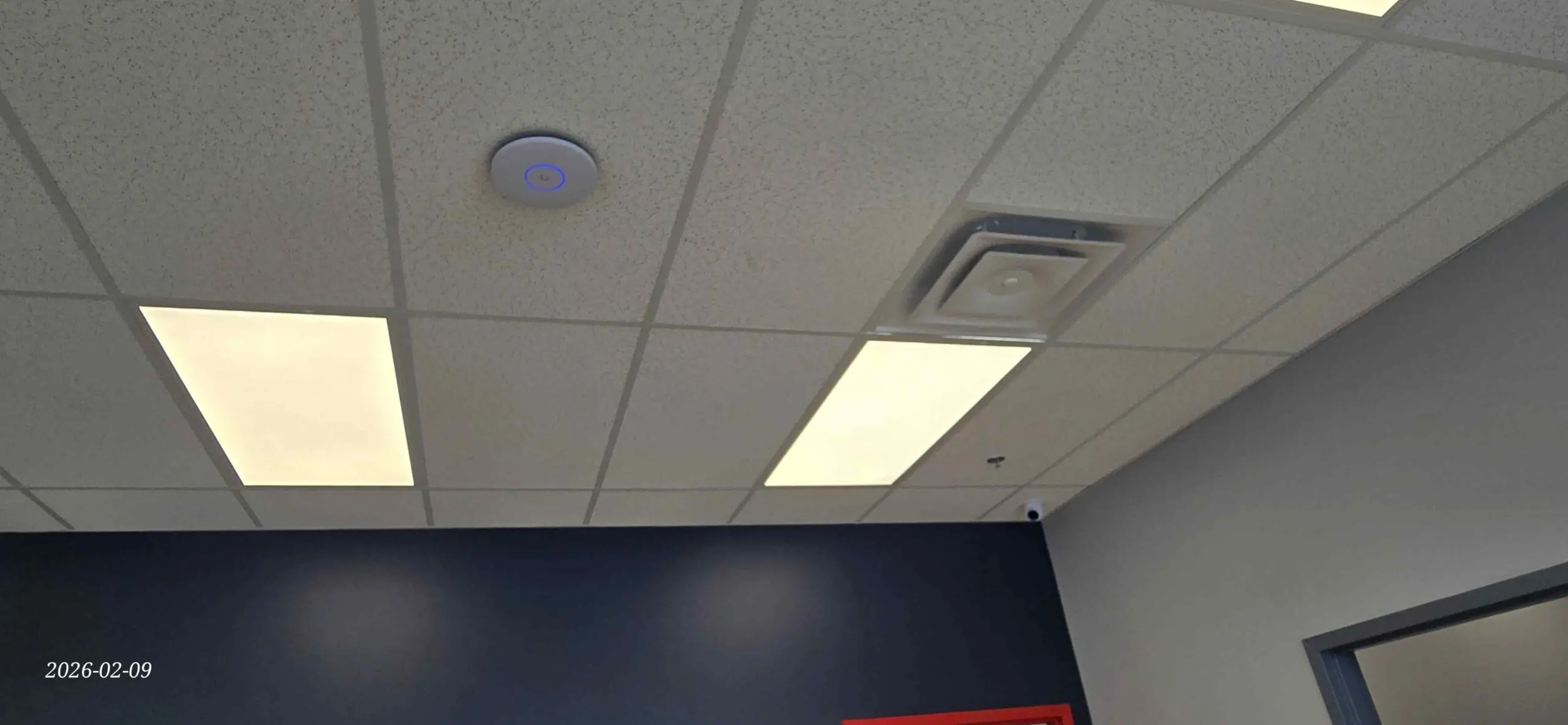 UniFi ceiling-mounted Wi-Fi access point installed in a GTA commercial space