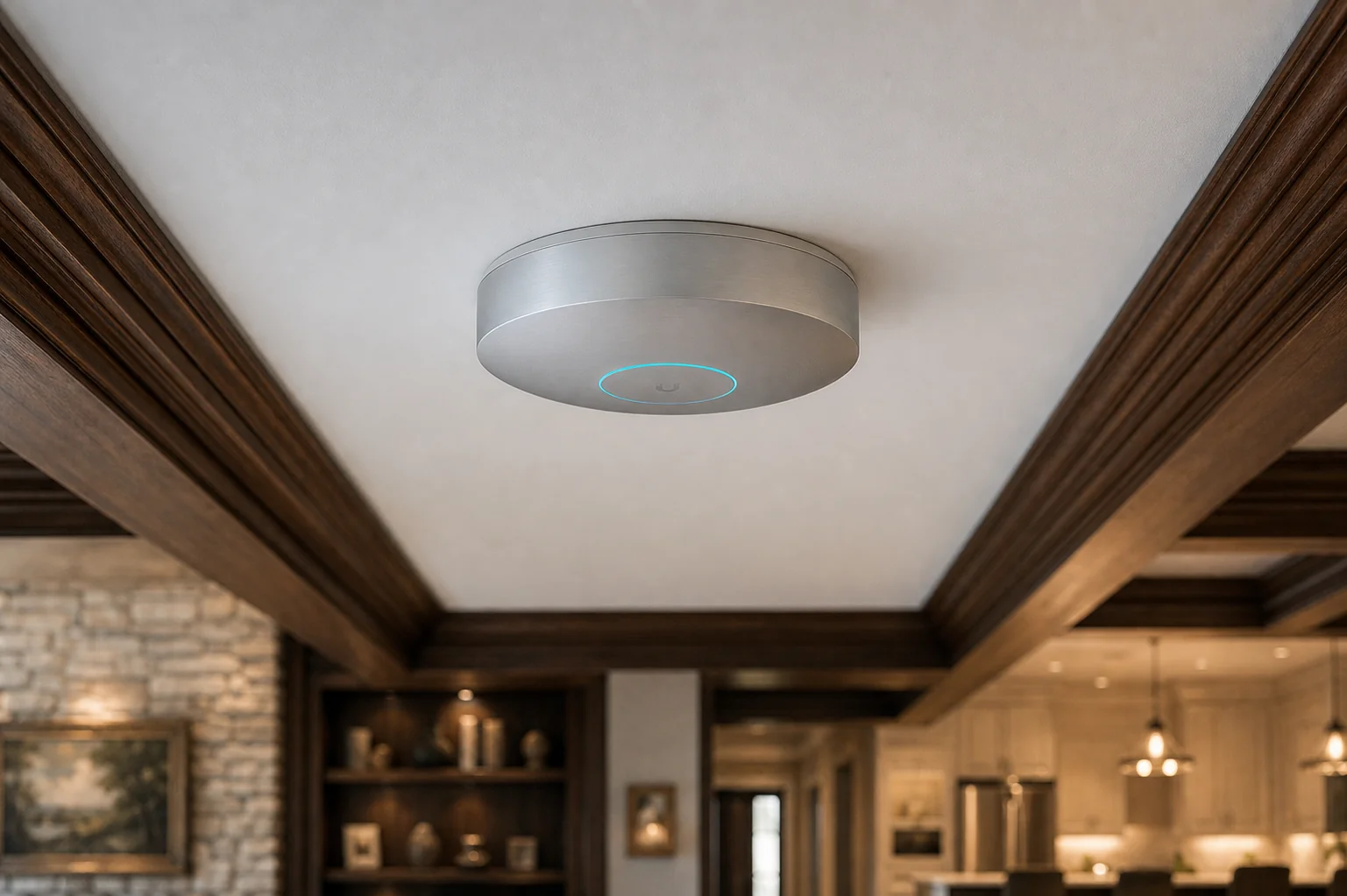 Close-up of a UniFi U7 Pro Max Wi-Fi 7 access point ceiling-mounted in a Bayview Hill open-plan main floor, showing the brushed-aluminum housing and PoE backhaul &mdash; Richmond Hill installation by SetupTeam