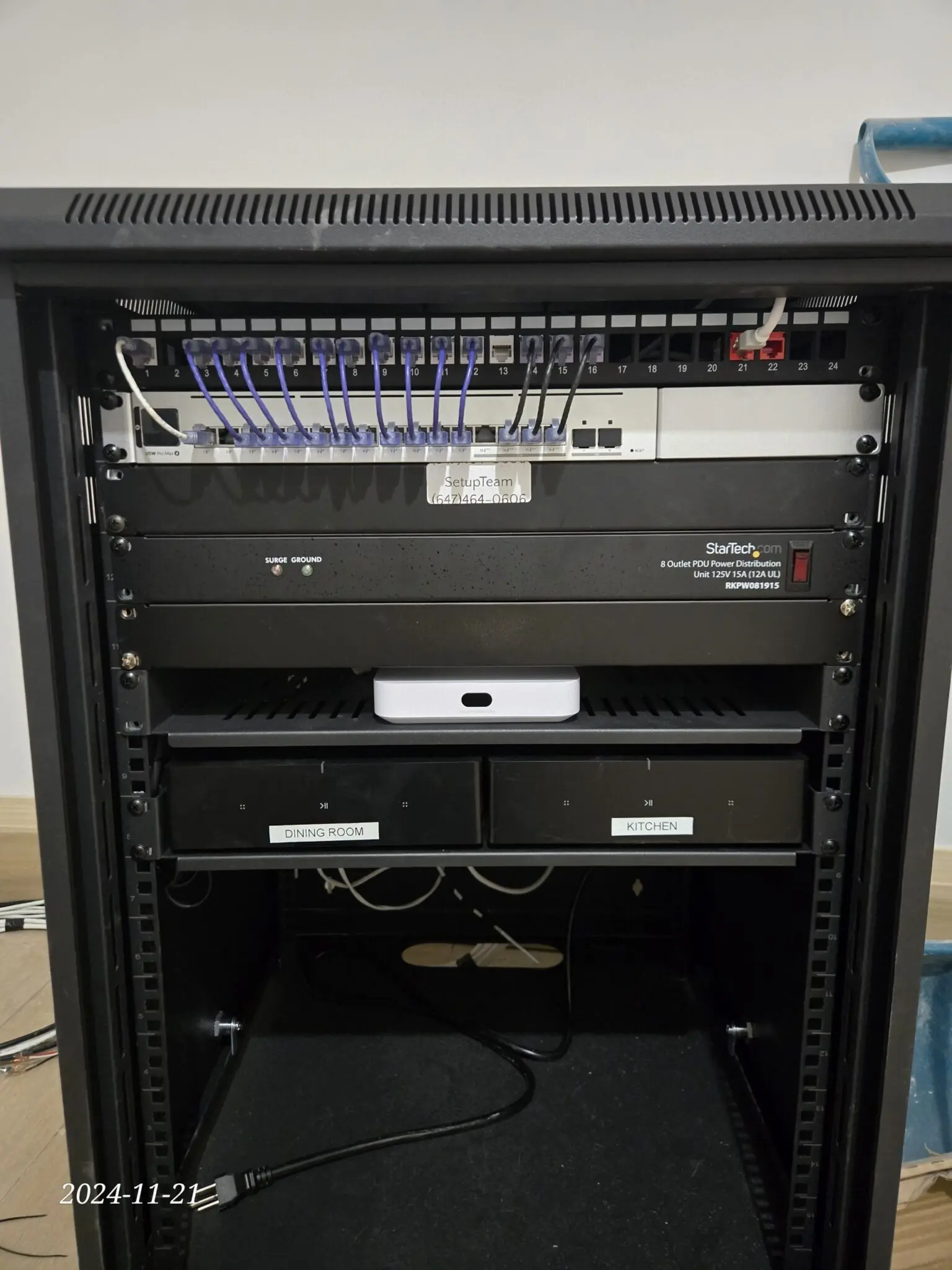 UniFi network rack with structured wiring and Sonos Amps