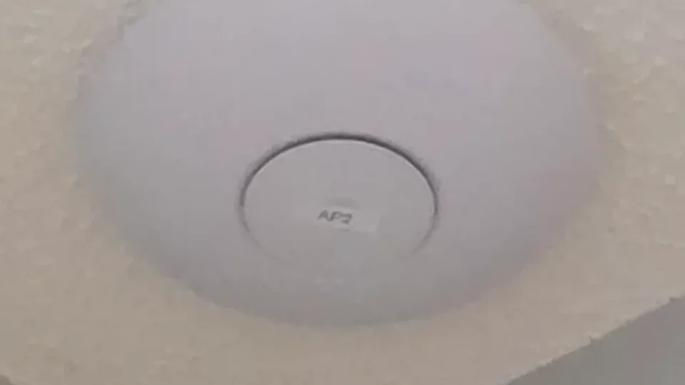 UniFi U7 Pro ceiling access point with an AP2 label that matches its name in the UniFi app