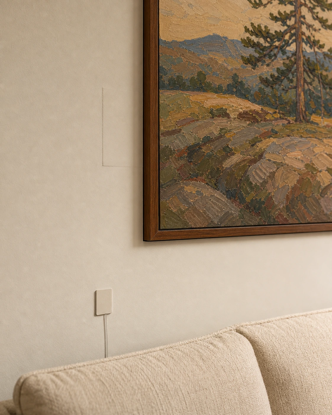 Cross-section architectural-detail image of a Samsung Frame TV flush-mounted with the no-gap bracket against fresh warm-white drywall in a Vaughan great room, showing the Beveled walnut bezel at zero millimetres proud, a recessed power outlet visible behind the screen, and the Invisible Connection optical cable exiting through a low-voltage plate at the base of the wall