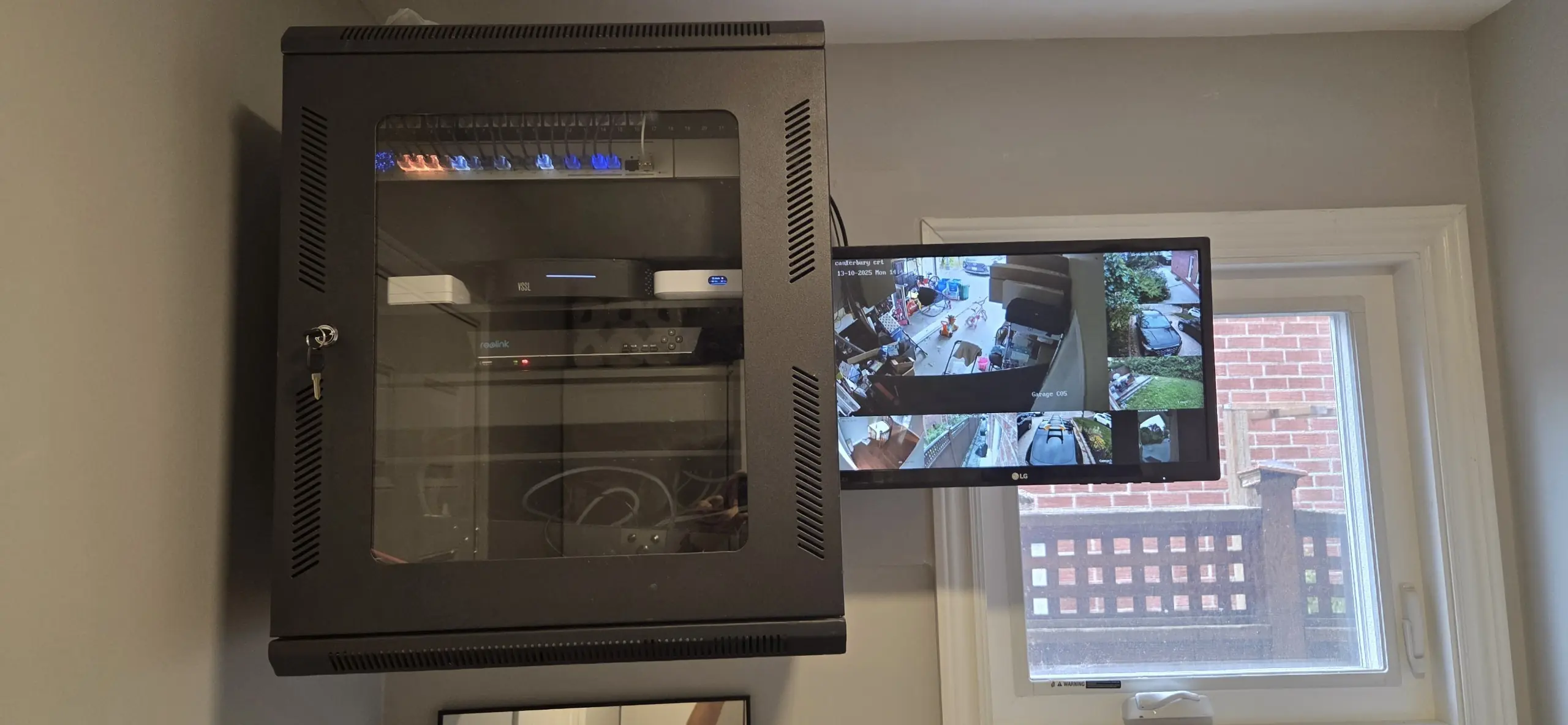 Wall rack with Wi-Fi, networking, camera, and NVR equipment