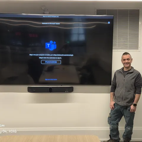 Professional Microsoft Teams Room installation with large commercial display and Poly video conferencing system in Toronto.