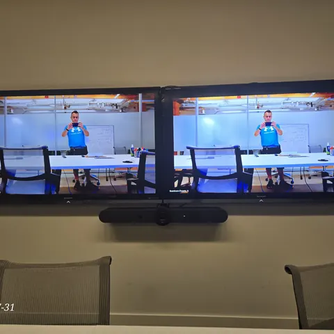 Zoom Room with Logitech Rally dual display installation for a professional office conference room in Toronto.
