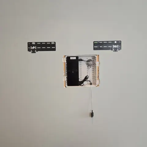 Samsung Frame TV mounting preparation with recessed low-voltage enclosure, One Connect Box housing, and flush wall mount installation completed by SetupTeam in Toronto.