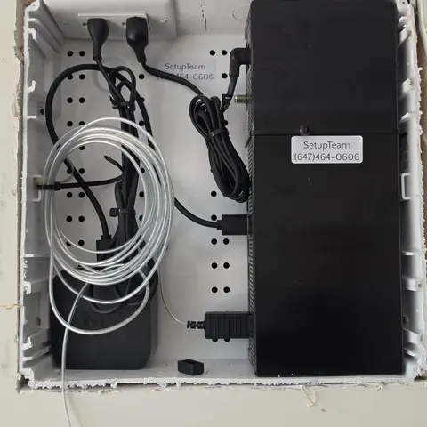 Recessed media enclosure housing Samsung The Frame One Connect box and Sonos equipment with organized power and signal cabling. Installation by SetupTeam.