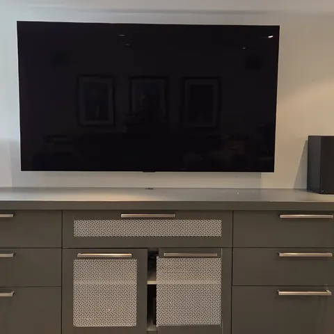 Custom basement home theater installation with large-format TV and bookshelf speakers completed by SetupTeam in Richmond Hill.
