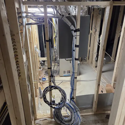 Structured low-voltage pre-wiring for home theater, networking, Control4 automation, and security systems during residential construction in Oakville.