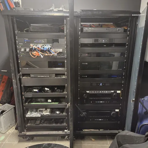 Custom home theater and Control4 network rack installation with Araknis networking, Triad amplifiers, AV receivers, and structured wiring completed by SetupTeam in Richmond Hill.