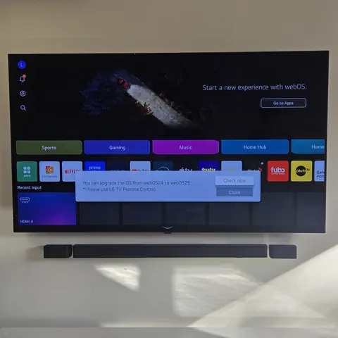 Professional LG TV wall mounting with soundbar installation and concealed wiring for a clean modern setup in North York.