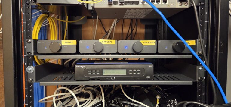 Commercial AV rack with audio distribution hardware and neatly managed cabling for a Yorkdale Mall TV installation
