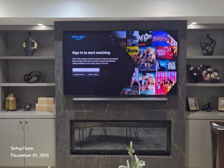 TV wall mounted over a tiled fireplace with Sonos Arc soundbar and built-in shelving