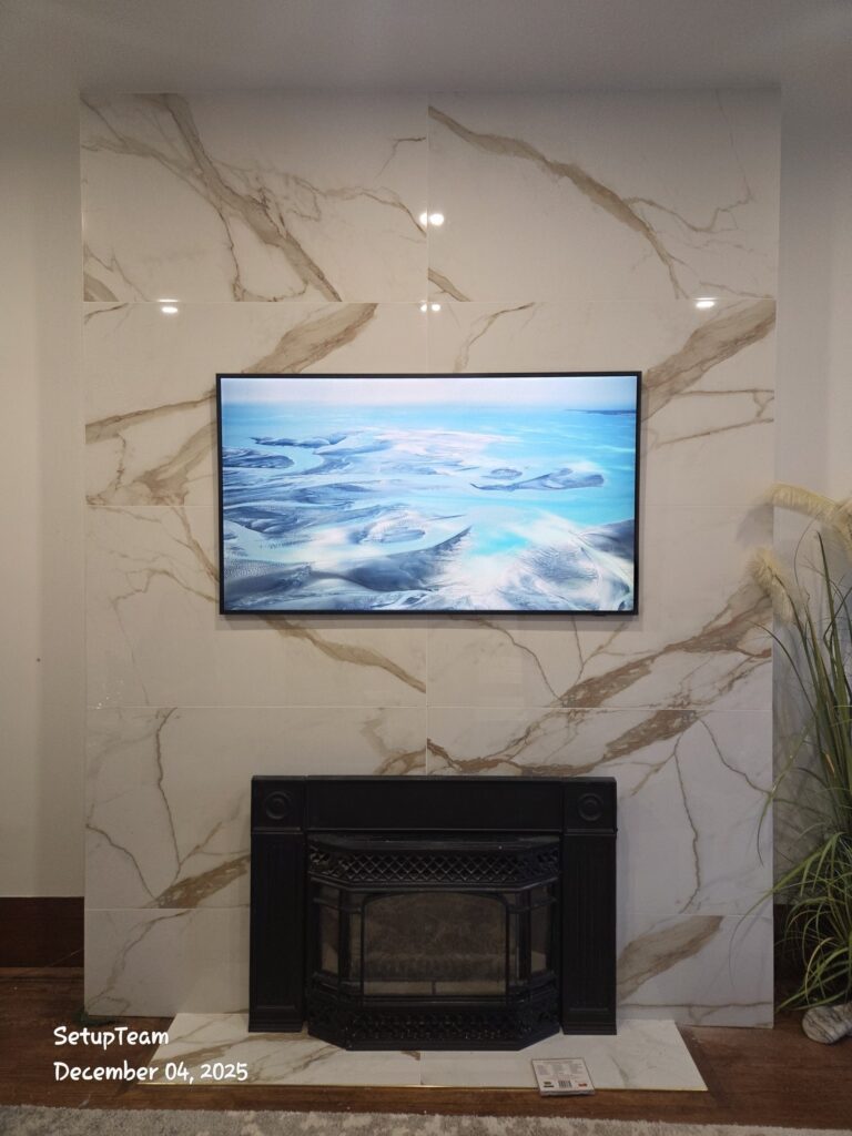 Samsung Frame TV wall-mounted on a porcelain feature wall above a fireplace with concealed wiring