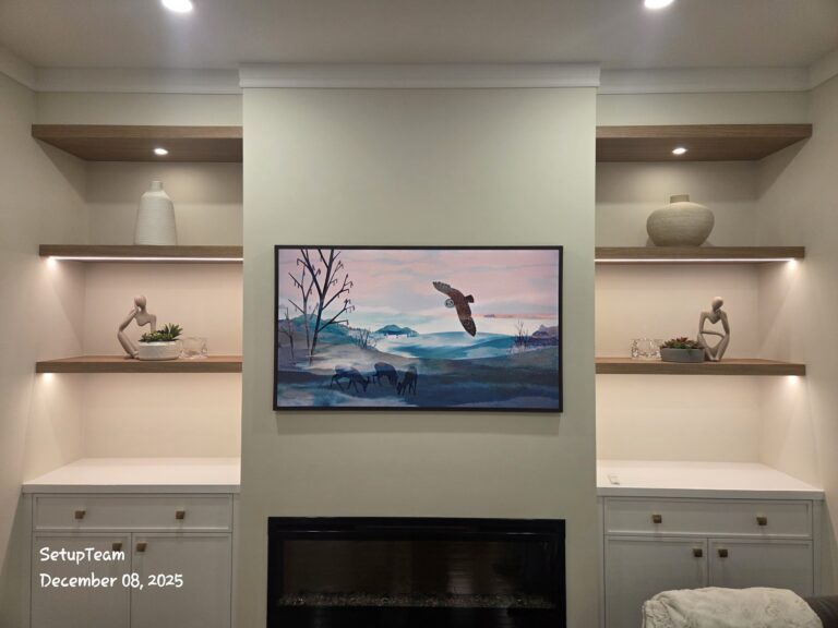 Samsung Frame TV mounted above a fireplace with clean cable management