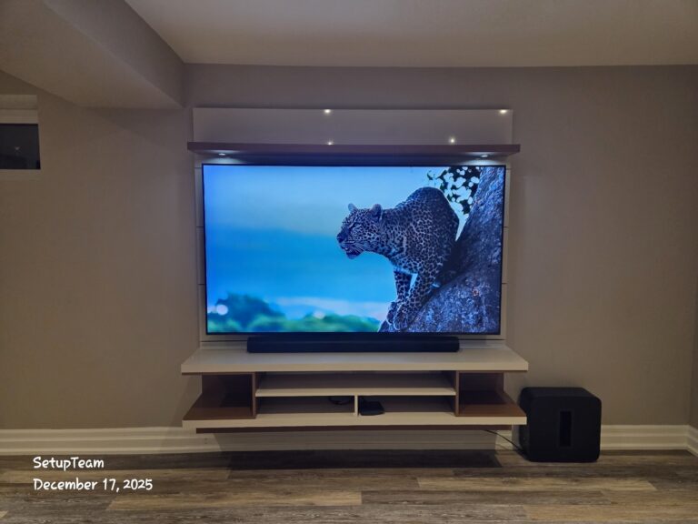 TV and Sonos home theatre setup with a subwoofer beside the media unit