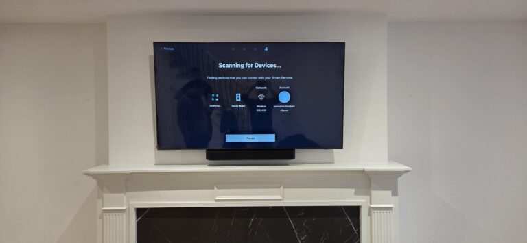 TV installation above a fireplace with a clean, centered layout