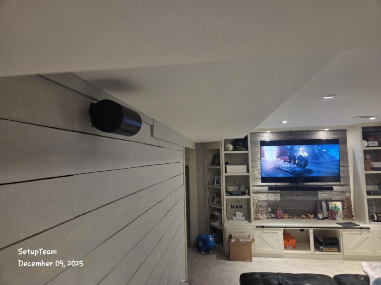 Wall-mounted TV with in-wall speakers and clean built-in media unit home theatre