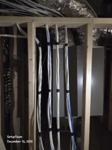 Low-voltage prewiring during rough-in with bundled cables routed through wall studs