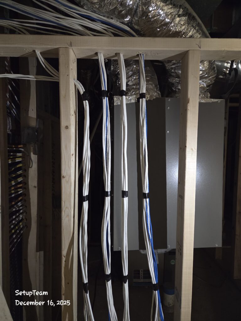 Low-voltage prewiring during rough-in with bundled cables routed through wall studs