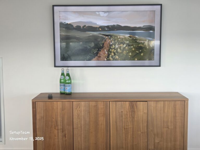 Samsung Frame TV wall mounted in a downtown Toronto condo with clean cable concealment