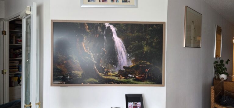 Hisense CanvasTV wall-mounted in a condo with a clean, art-style finish