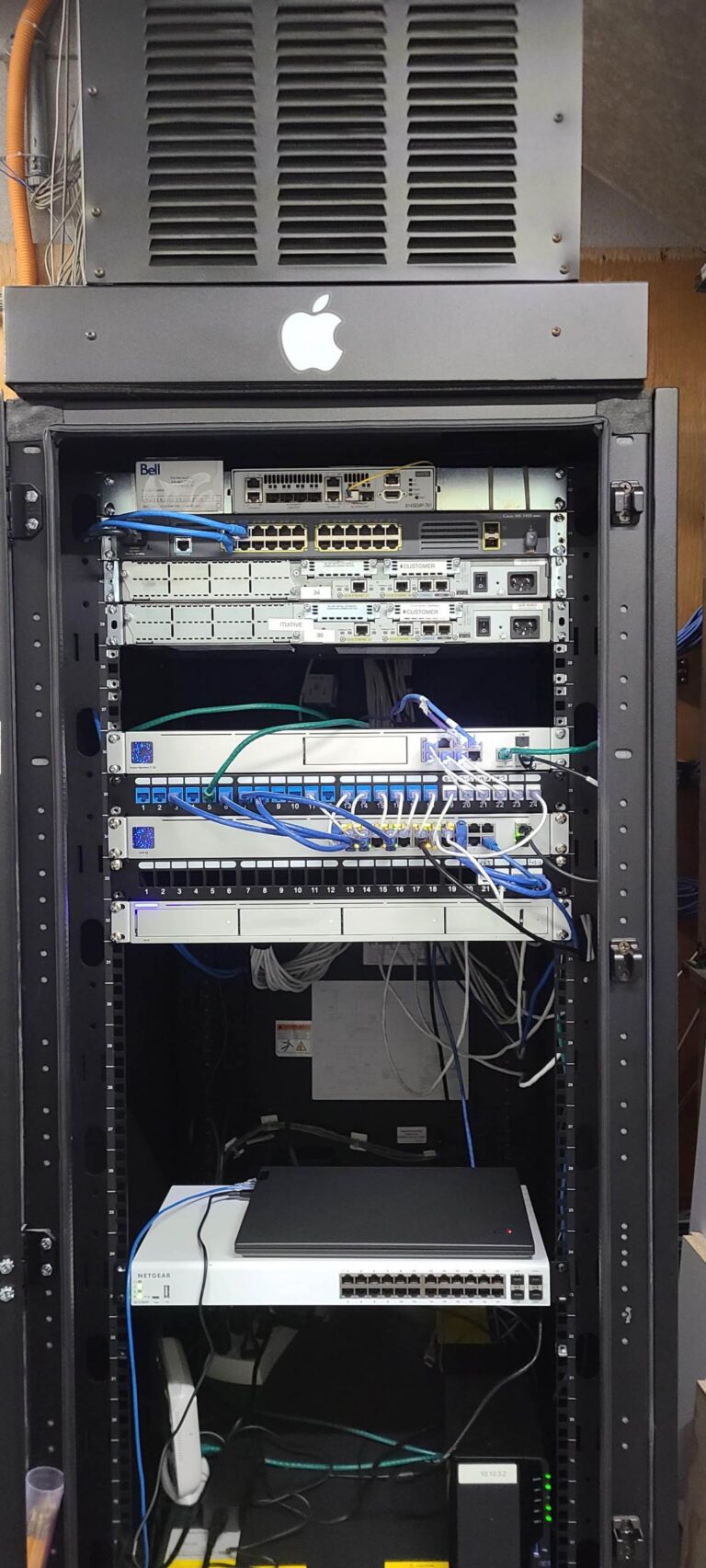 Network rack with patch panel and structured wiring terminations