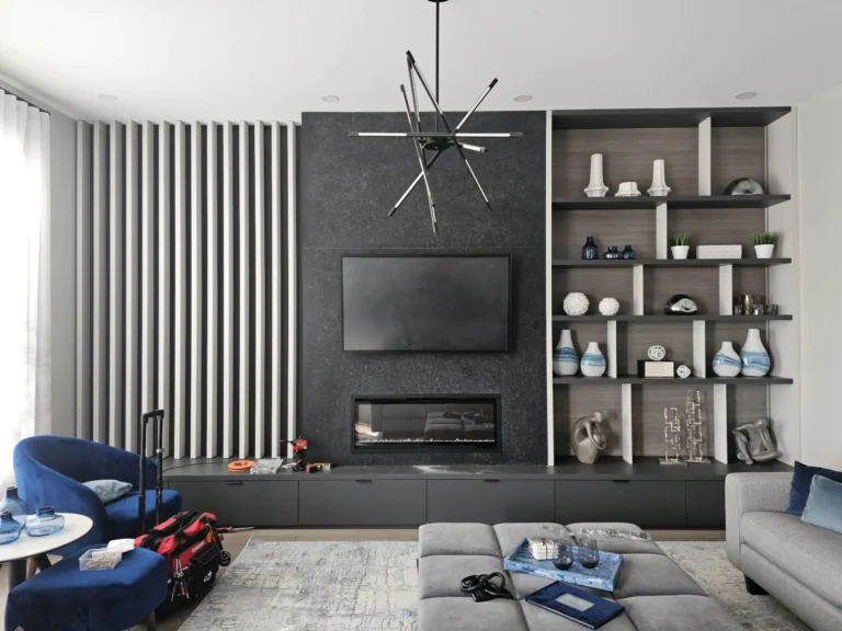 TV wall mounted above a porcelain fireplace with concealed cables in a modern Toronto living room.