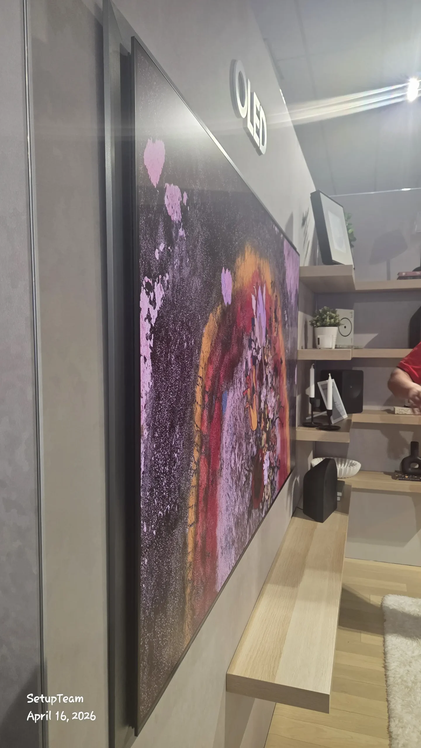 Side profile of the Samsung S95H OLED showing the flush FloatLayer wall-mount design