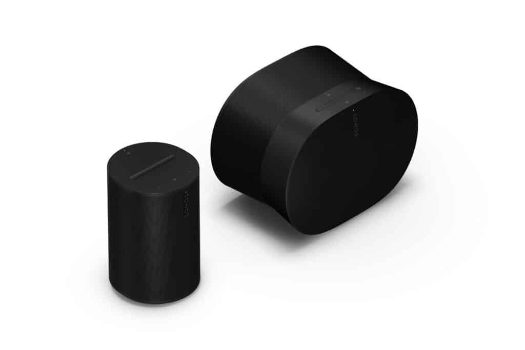 Black wireless speakers on white background.