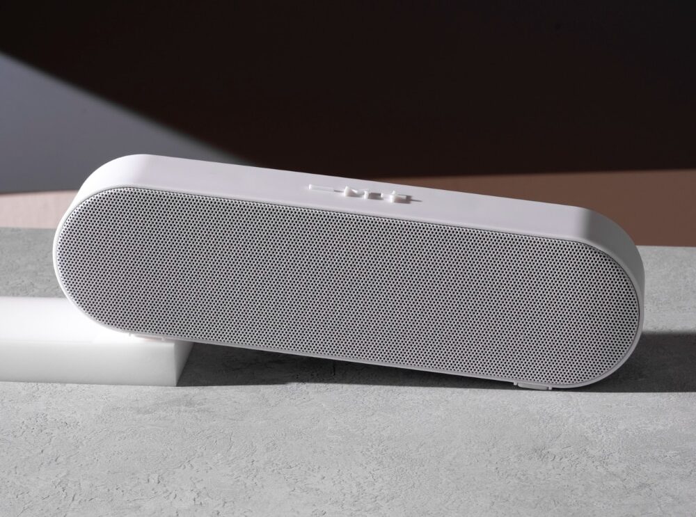 White sonos speaker on grey surface