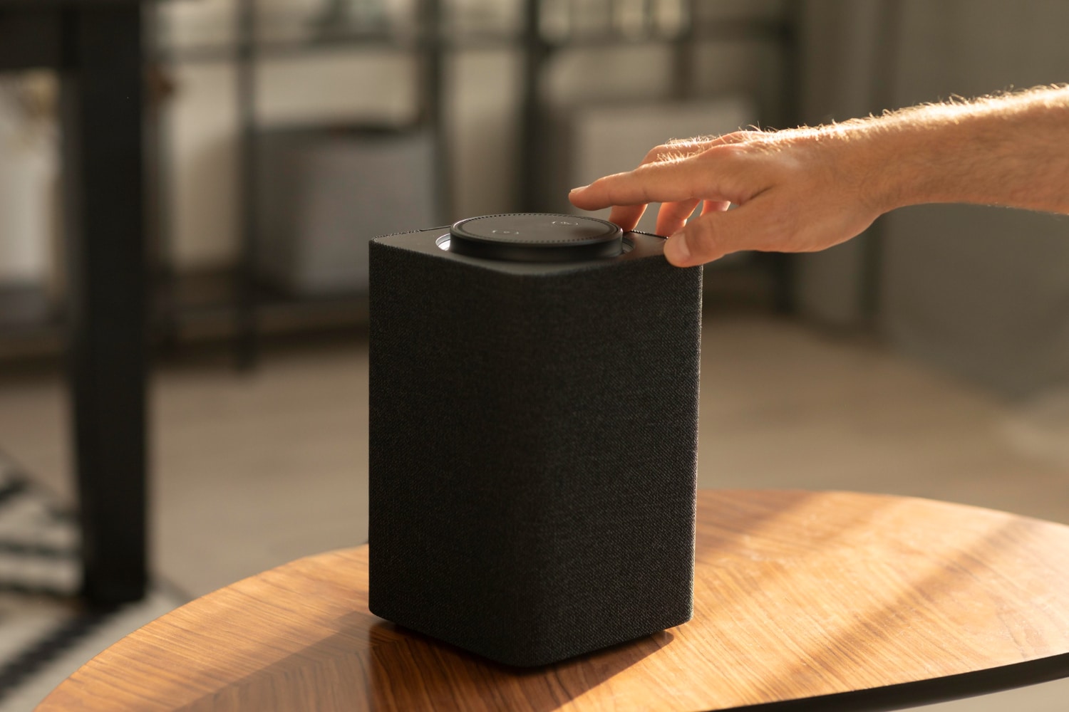 Hand adjusting sonos speaker volume
