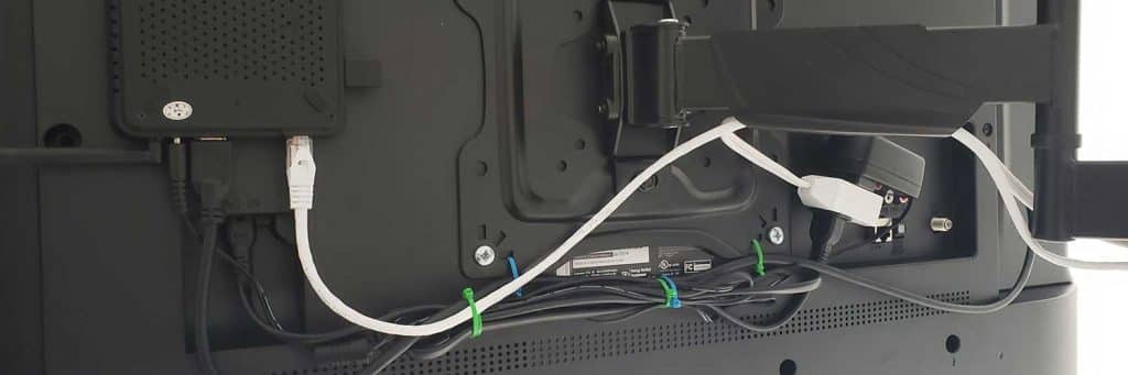 Back of mounted TV with connected cables